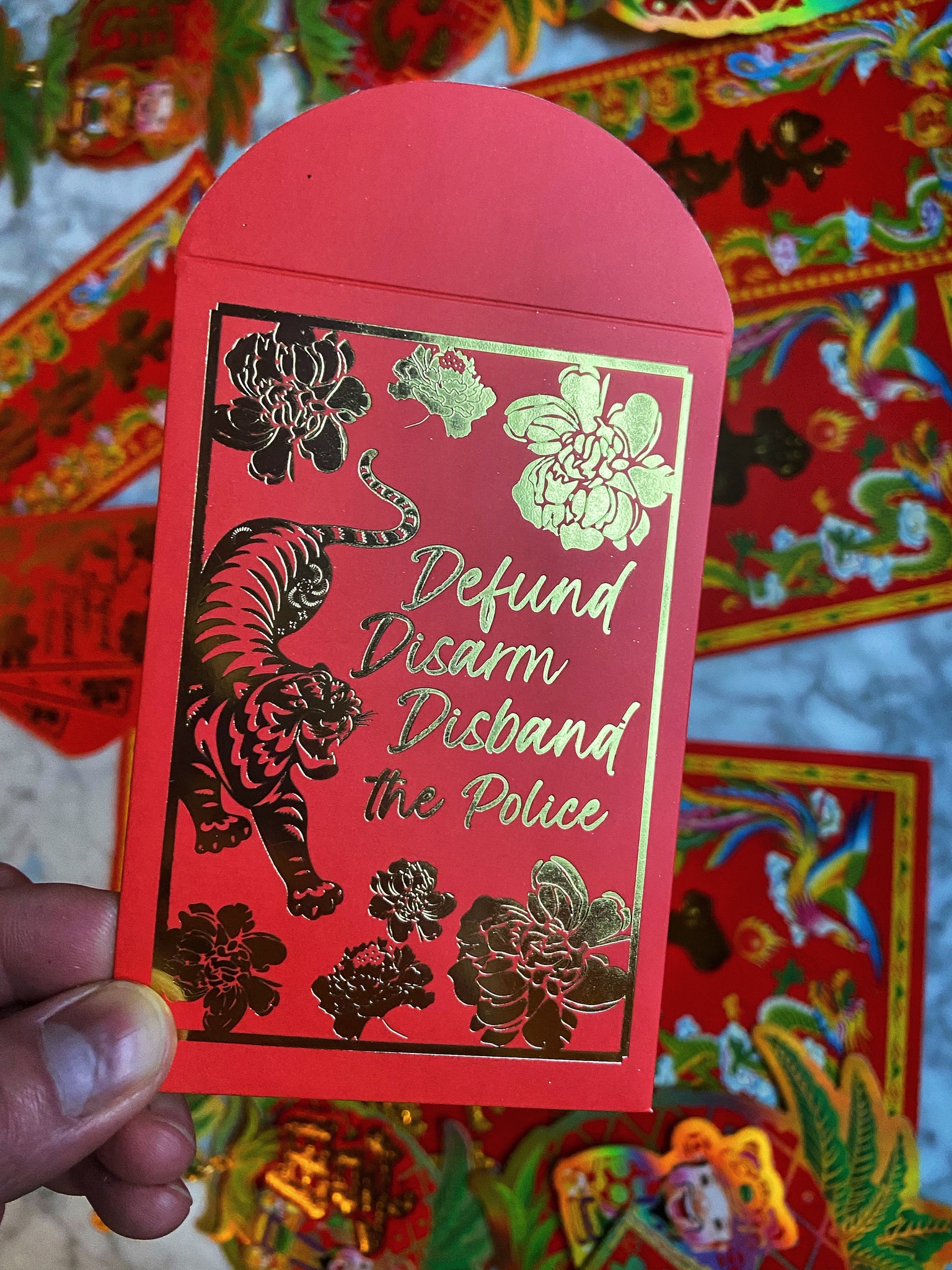 "Defund, Disarm, Disband the Police" red envelopes